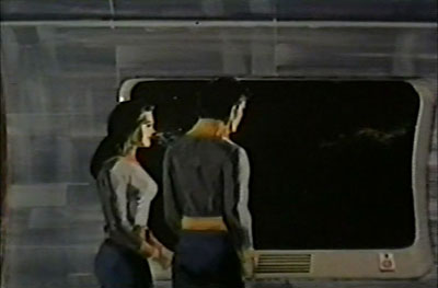 Crew of the Pegasus look through viewport in War of The Worlds TV Series