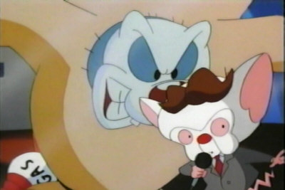 Brain is confronted by the alien in Battle For The Planet